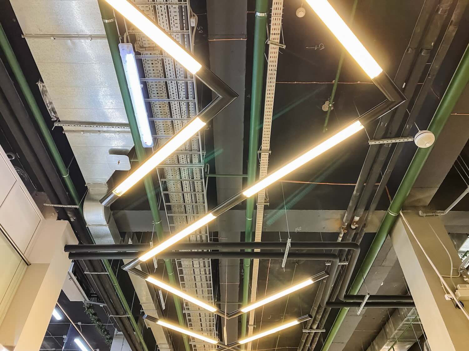 Ceiling adorned with numerous lights extravagantly suspended from it, creating a vibrant atmosphere and illuminating the space below with a warm and inviting glow