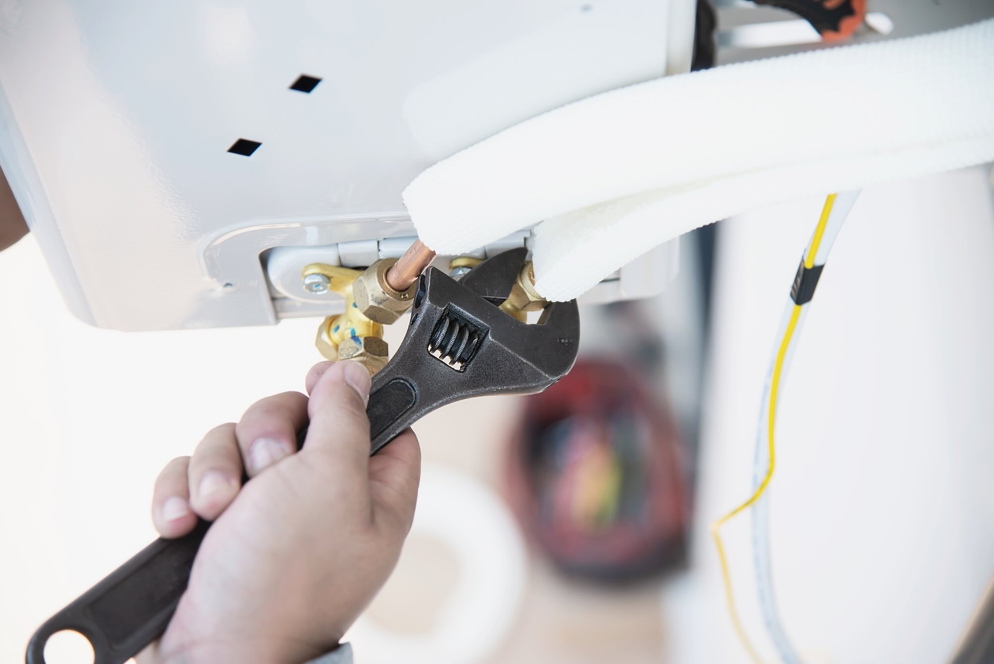 Engineer servicing gas boiler